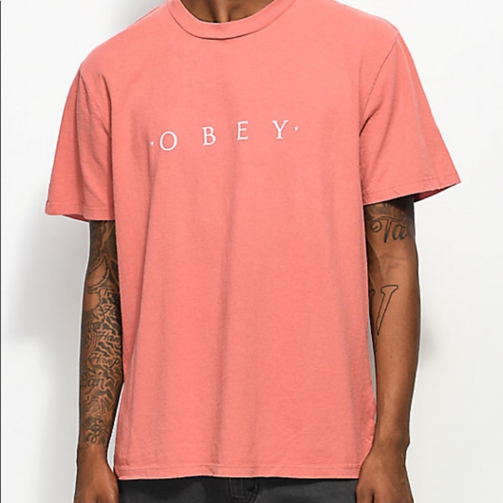 Salmon colored obey shirt